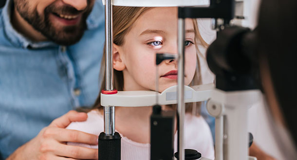 child taking pediatric eye exam