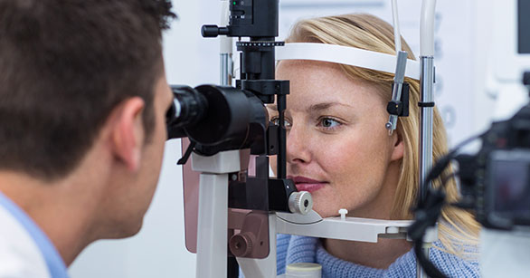 Woman taking diabetic retinopathy eye exam