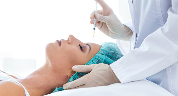 woman taking injectable filler