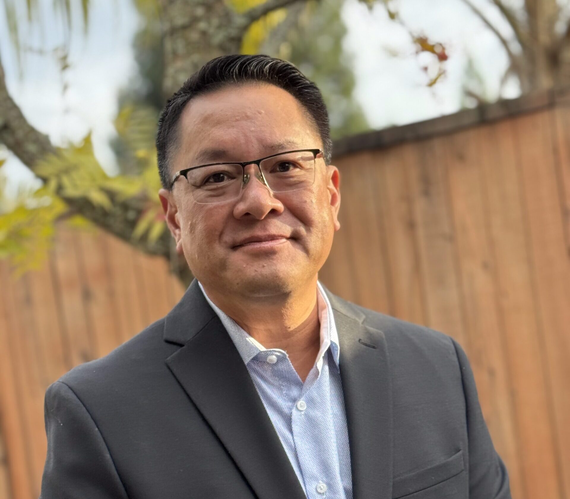 Patient receiving a comprehensive eye exam with phoropter at Foothills Optometry by Granite Pointe in Roseville, CA